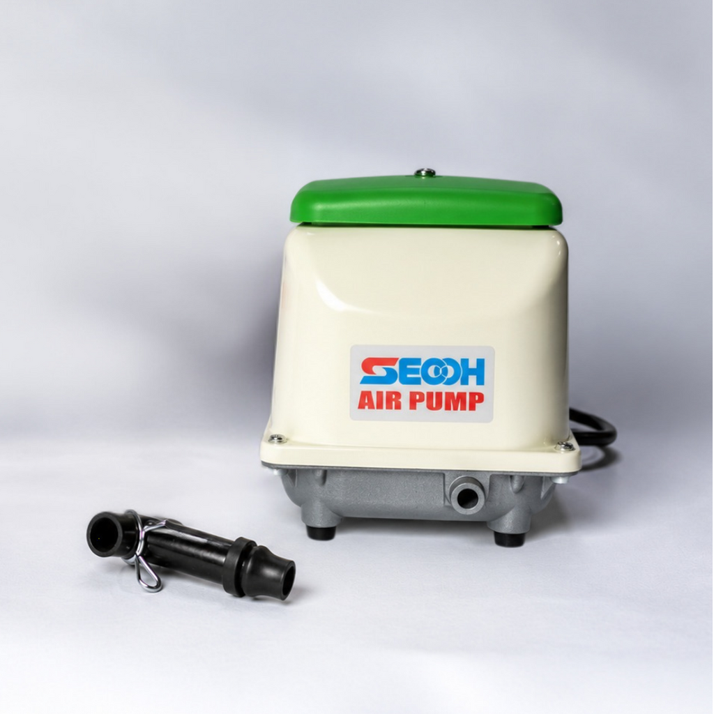 Secoh Internal L-Tube spare part sitting next to JDK80 air pump and box with a grey background