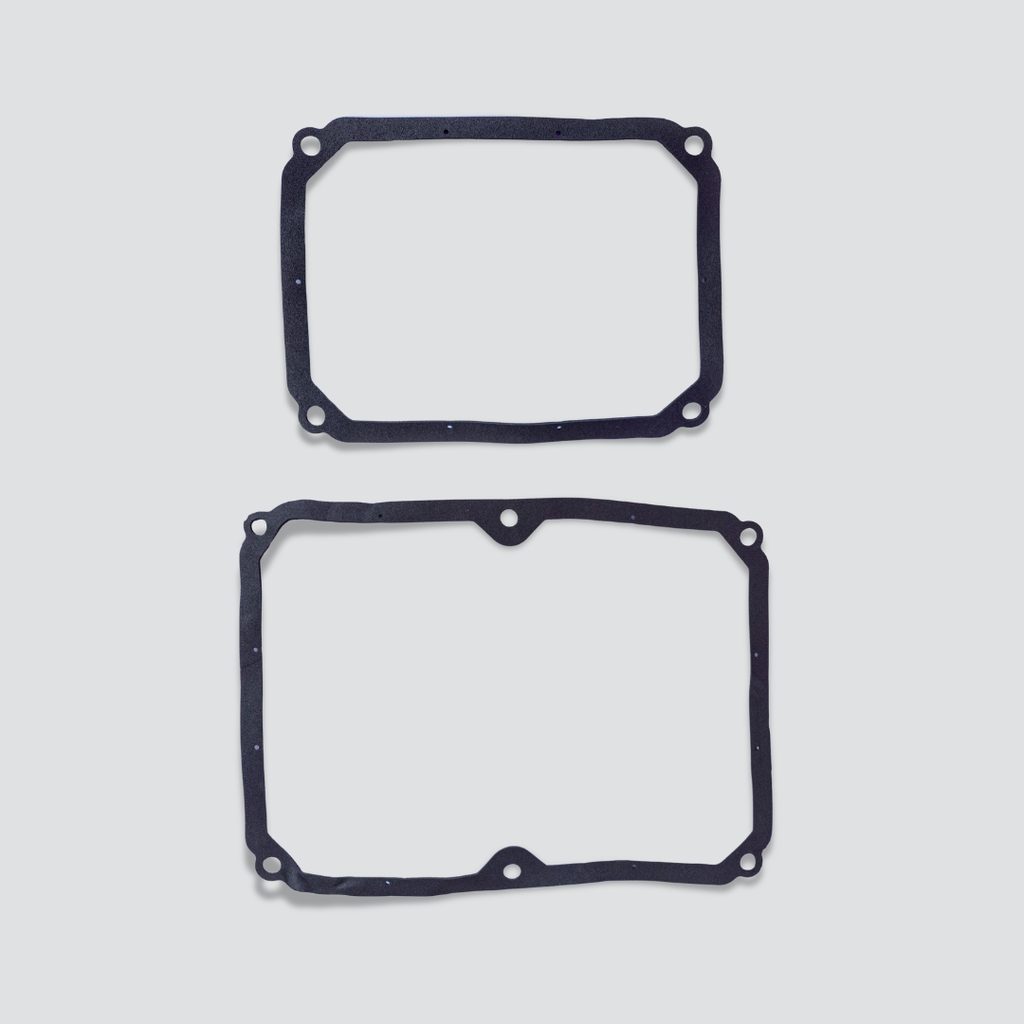Two black rubber gaskets with pre-drilled mounting holes for Secoh TKO200 air pump, displayed vertically on a light gray background.