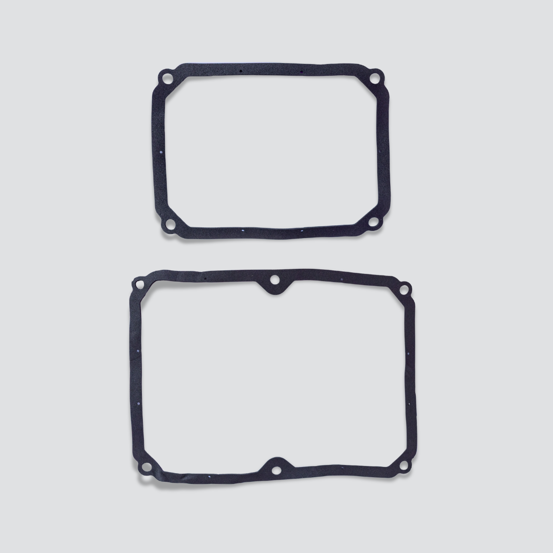 Two black rubber gaskets with pre-drilled mounting holes for Secoh TKO200 air pump, displayed vertically on a light gray background.