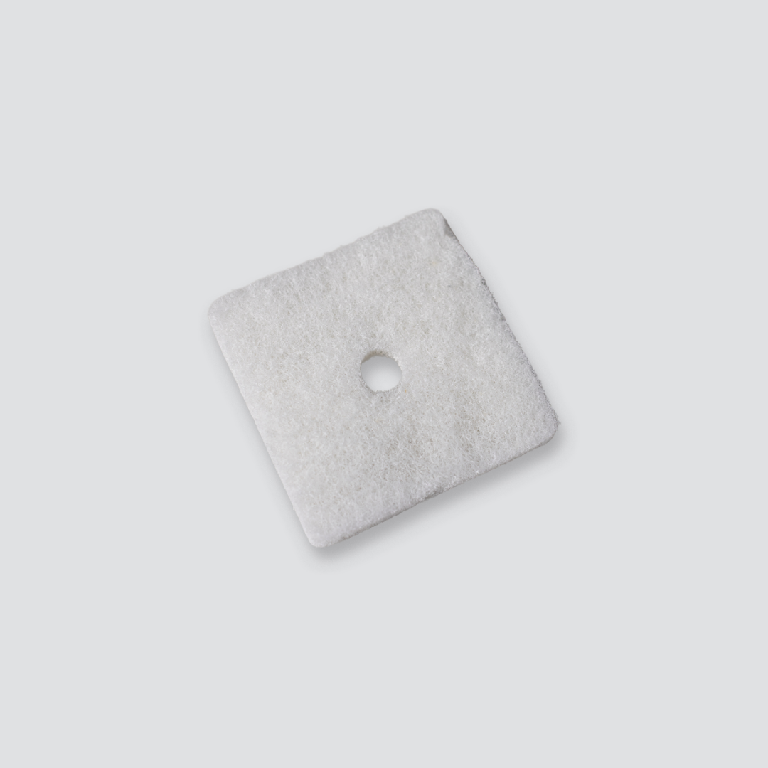 Gray white air filter with a circular cutout on a light gray background